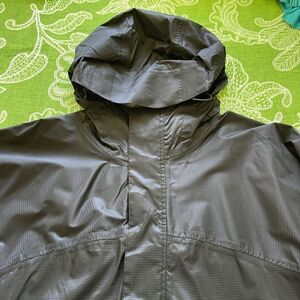 Rugged Exposure Raincoat.  Like new. Lots of pockets.  Size Large.